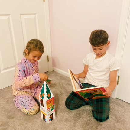Two children playing with toys on the floor in a room. with Chicka Chical Boom Boom Magnetic Tile Set