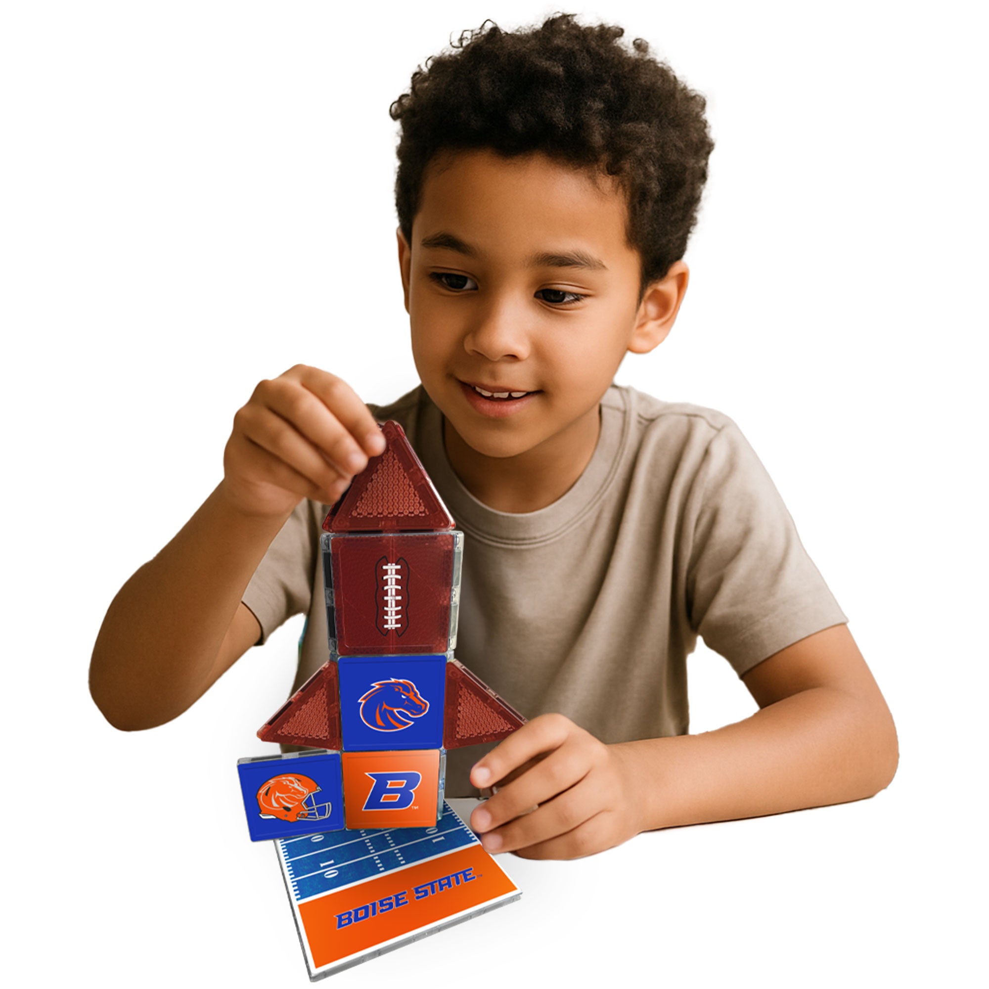 Child playing with Boise State-themed building blocks on a white background