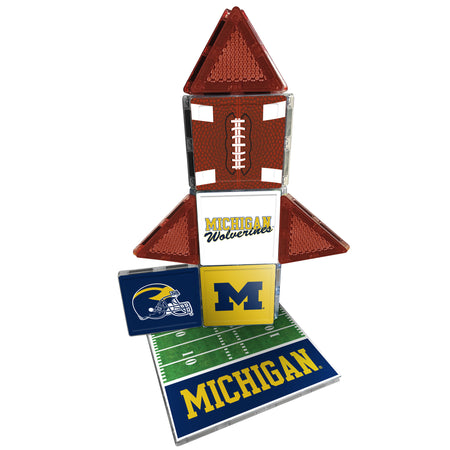 Michigan Wolverines-themed decorative item with football, field, and helmet design on a white background.