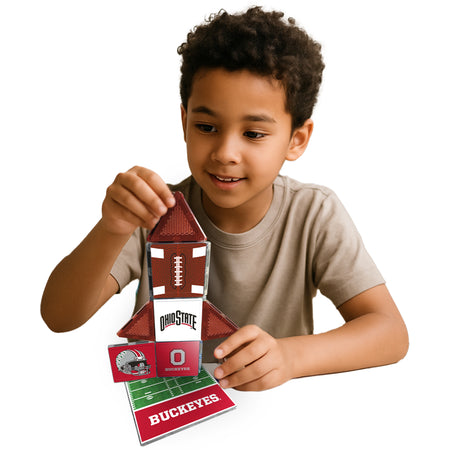 Child holding a Ohio State-themed card with a football design