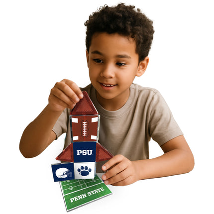 Child playing with a Penn State-themed tile set on a white background