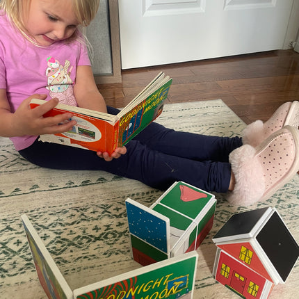 Child playing with colorful blocks on a patterned rug