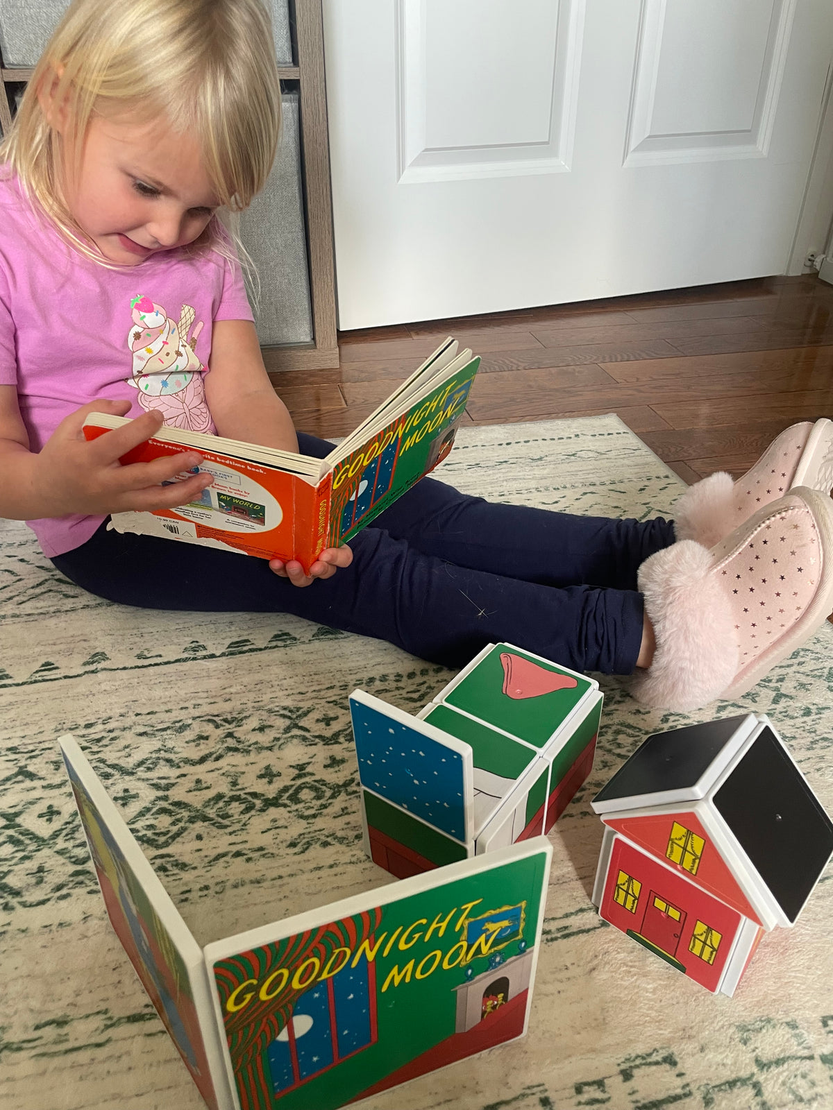 Child playing with colorful blocks on a patterned rug