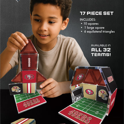 Child playing with NFL Fan Tiles on a dark background