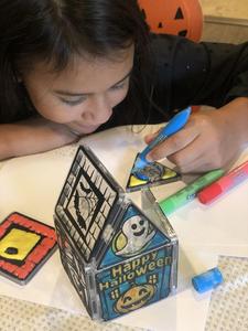 Child Painting A Happy Halloween House Magnatiles Set