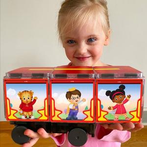 Girl Holding Daniel Tiger Trolley Magna-Tiles by CreateOn