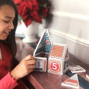 Girl Playing with Gingerbread Advent Calendar Magnatile Structure Set
