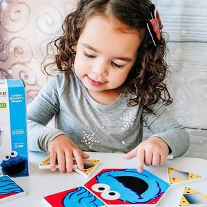 Girl Playing with Cookie Monster Magna Tiles