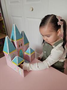 Girl Playing with a Princess Castle Magnatile Set