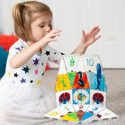 Child Playing with Eric Carle Magnatile Structure Set
