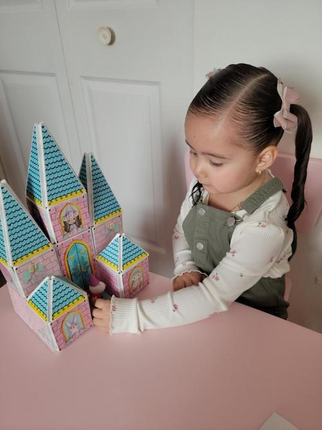 Girl Playing with a Princess Castle Magnatile Set